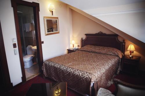 Cama o camas de una habitación en Hotel Millenium