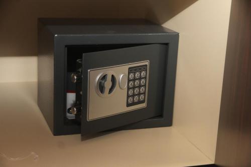 a black and white microwave on a wall at Hotel Dum by Muskat in Belgrade