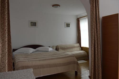 a bedroom with a bed and a couch at Central city AP in Sibiu