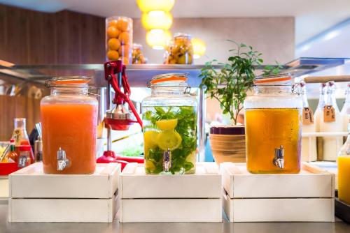 three mason jars filled with different types of liquid at Radisson Blu Hotel, Ordu in Ordu