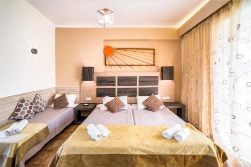A bed or beds in a room at Acapulco Marinos Apartments- Adults Only
