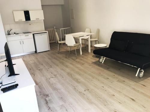 a living room with a couch and a table at Olosuites in Limassol