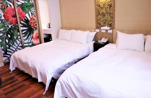 Ένα ή περισσότερα κρεβάτια σε δωμάτιο στο Guest Motel-Zhubei