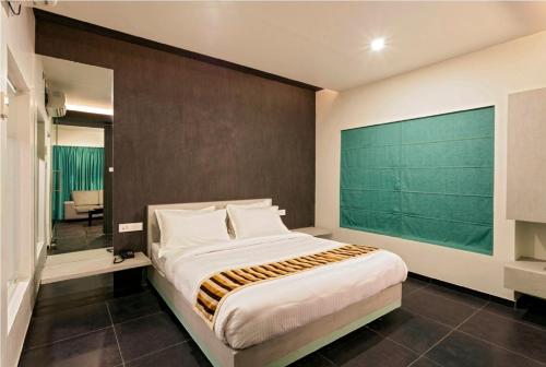 Hotel Rasikaにあるベッド