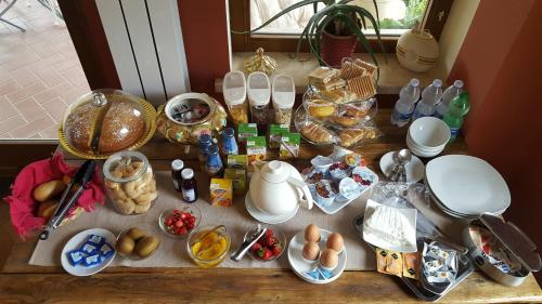 a table with food and other food items on it at Il Nido del Falco in Castel Gandolfo