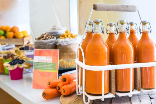 a group of bottles of orange juice on a counter at Park Inn by Radisson Makkah Al Naseem in Makkah