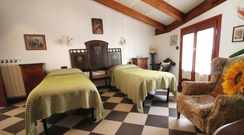 A bed or beds in a room at Albergo Santo Spirito