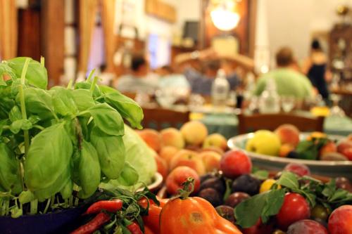 a bunch of fruits and vegetables on a table at Albergo Santo Spirito in Molini di Triora
