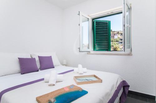 a bedroom with a bed with a tray on it at Villa Kristina in Sevid