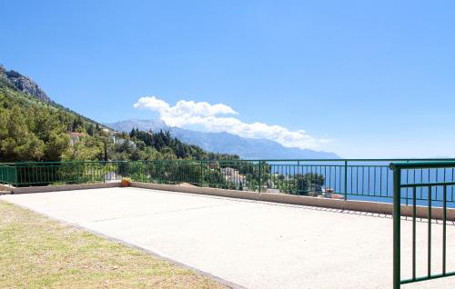 a balcony with a view of the water and mountains at Apartments Mirko in Mimice