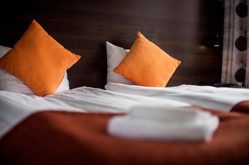 Säng eller sängar i ett rum på First Hotel Solna