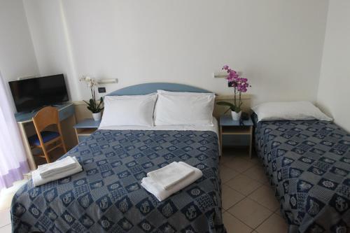 Postel nebo postele na pokoji v ubytování Hotel Giorg - WaterPark Included