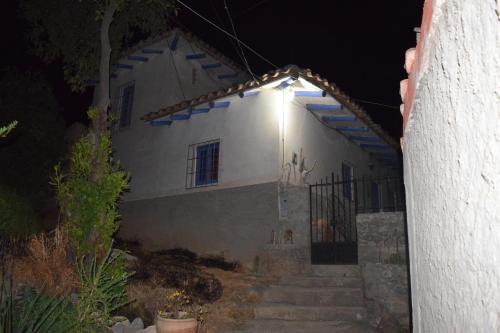 a white house at night with stairs leading to it at La Casita de mi Abuela in Mancos