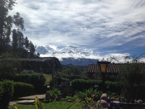 a view of a snow covered mountain from a garden at La Casita de mi Abuela in Mancos