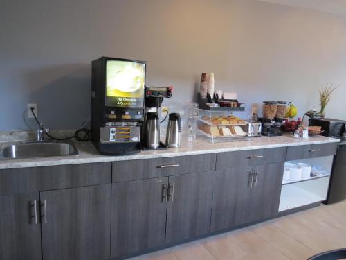 a kitchen with a counter with a coffee machine at Rest Inn in Terrace