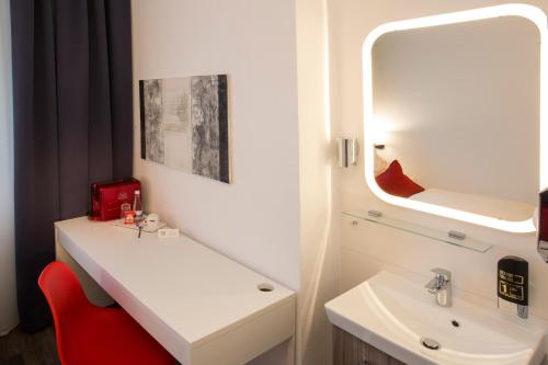 Ett badrum på Hotel Mille Stelle City