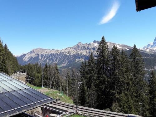 a view of the mountains from a train station at Hotel Alpenblick Mürren in Mürren