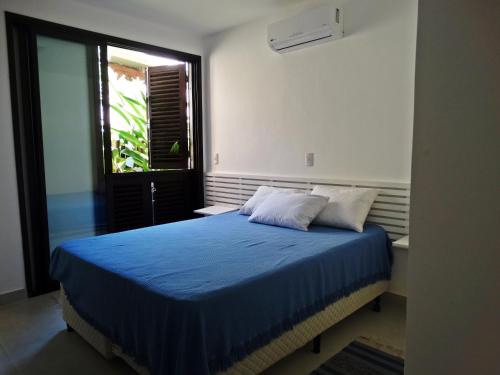 Postel nebo postele na pokoji v ubytování Casa de Praia