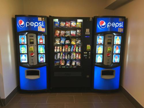 two vending machines in a room with food and drinks at Microtel Inn & Suites by Wyndham in Sandston