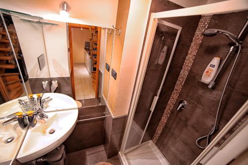 a bathroom with a sink and a shower at La Corte in Cava deʼ Tirreni