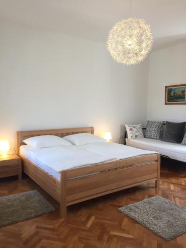 Postel nebo postele na pokoji v ubytování Central House Nona