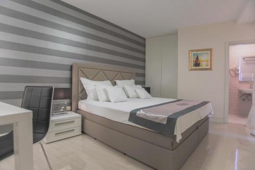 Postel nebo postele na pokoji v ubytování Villa Mendes