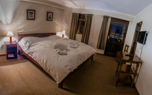Postel nebo postele na pokoji v ubytování Hotel Santa Cruz