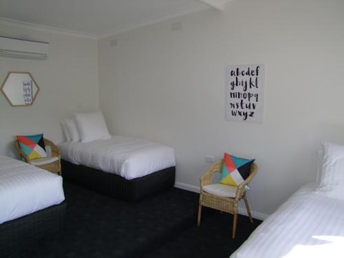 Postel nebo postele na pokoji v ubytování Corryong Hotel Motel