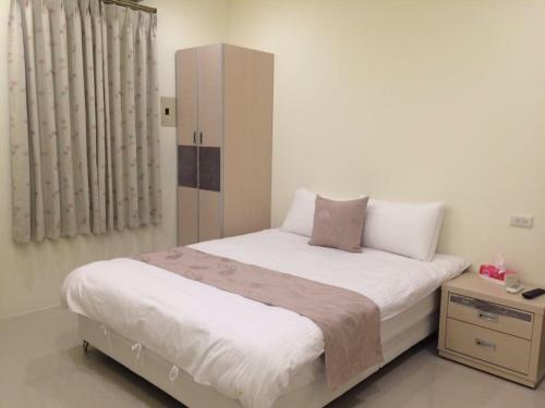 Una cama o camas en una habitación de 宜蘭樂活小屋
