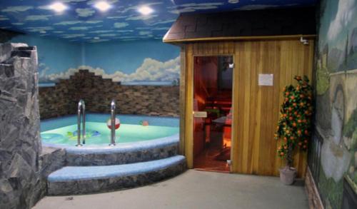 a bathroom with a jacuzzi tub in a building at Hotel Sfera Barnaul in Barnaul