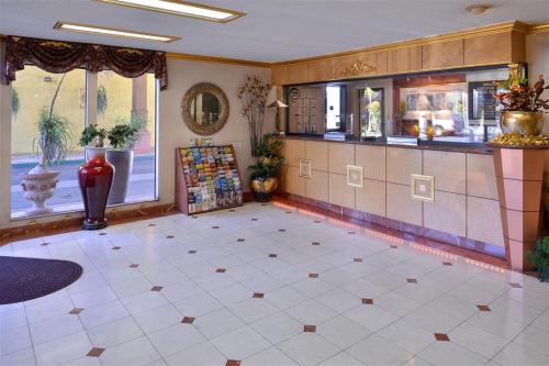 a large room with a counter and a tile floor at Americas Best Value Inn & Suites - Fontana in Fontana