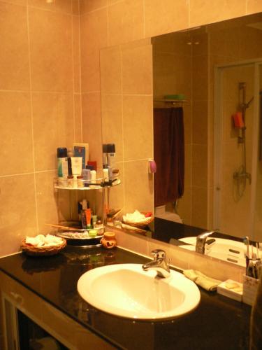 a bathroom with a sink and a mirror at View Talay resort 5c condo 115A minimum stay 29 nights in Pattaya South