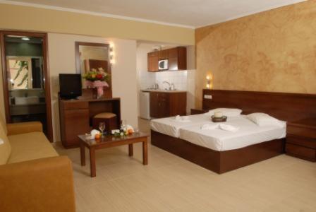 Ένα ή περισσότερα κρεβάτια σε δωμάτιο στο Sacallis Inn Beach Hotel 