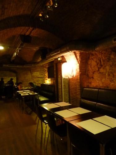 a row of tables and chairs in a restaurant at Roma Reial in Barcelona