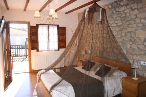 Postel nebo postele na pokoji v ubytování Trisileja en Posada La Busta