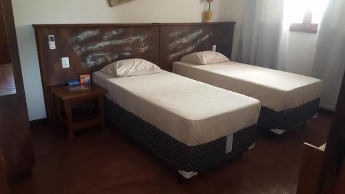 Ένα ή περισσότερα κρεβάτια σε δωμάτιο στο Country Club Pititinga