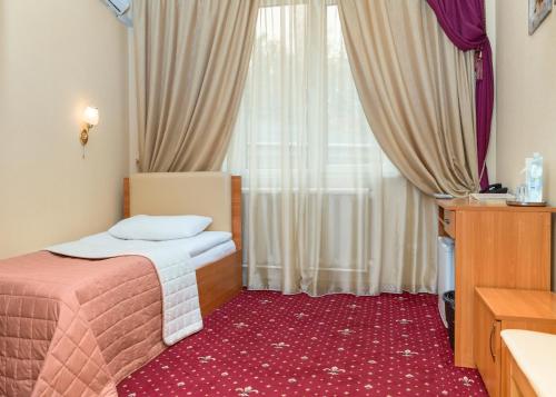 Ένα ή περισσότερα κρεβάτια σε δωμάτιο στο Shine Hotel