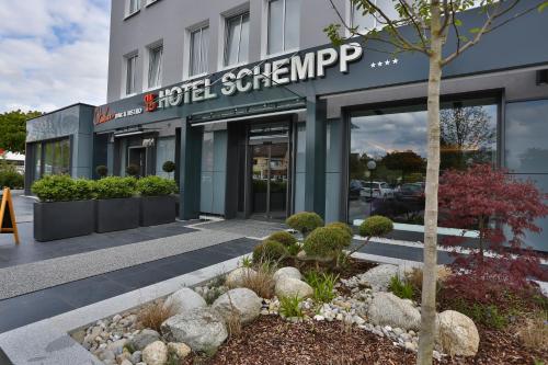 a building with a sign on the front of it at Hotel Schempp in Bobingen