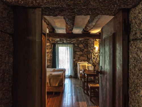 Ένα ή περισσότερα κρεβάτια σε δωμάτιο στο Quinta do Rapozinho