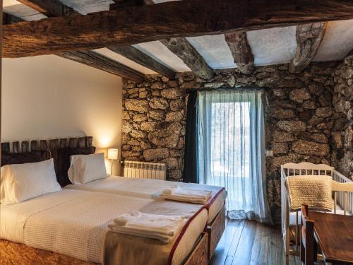 Cama o camas de una habitación en Quinta do Rapozinho