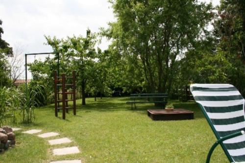 a park with a picnic table and a bench in the grass at Gaestehaus Celina_ WE32747 in Gingst