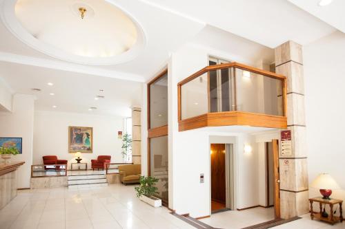 a lobby of a building with a glass ceiling at Hotel Princess in Mendoza
