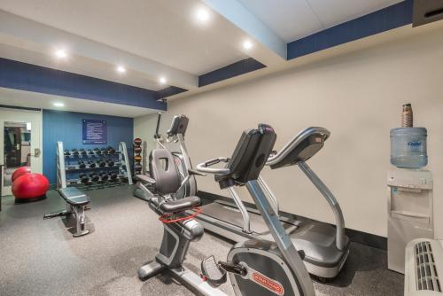a gym with two exercise bikes in a room at Wingate by Wyndham Springfield in Springfield