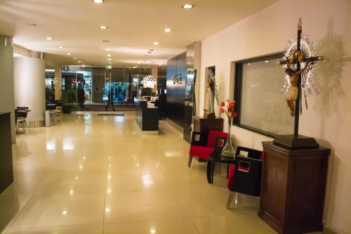 a large lobby with a cross on the wall at Hotel Las Vegas in Salta