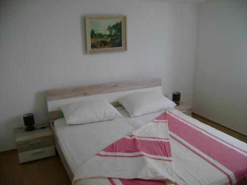 מיטה או מיטות בחדר ב-Apartment Zagor