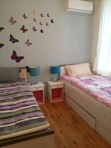 Postel nebo postele na pokoji v ubytování Florata apartment