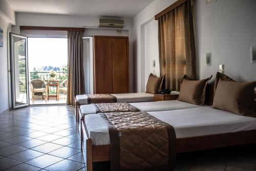 Posteľ alebo postele v izbe v ubytovaní Hotel Ilios