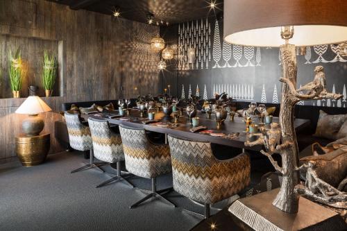 a conference room with a long table and chairs at Gilpin Hotel & Lake House in Bowness-on-Windermere