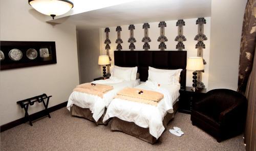 מיטה או מיטות בחדר ב-Witwater Guest House & Spa