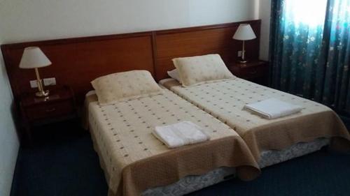 Кровать или кровати в номере Rosary Sister Guest House Ein Karem